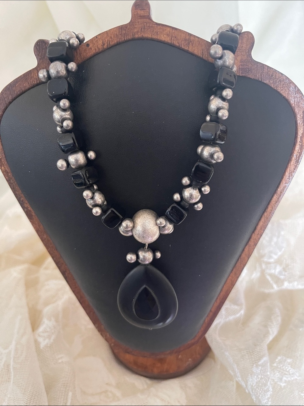 Black Teardrop Pendant Necklace with Silver Accents